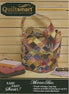 Quiltsmart Mondo Bag with colorful patchwork design on a wooden surface