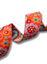Colorful floral patterned ribbon on a white background