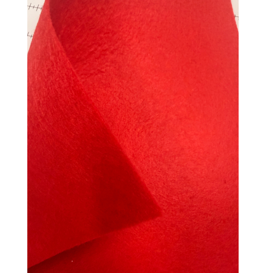 Close-up of red fabric with a textured surface