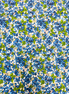 Pattern of blue berries and green leaves on a white background
