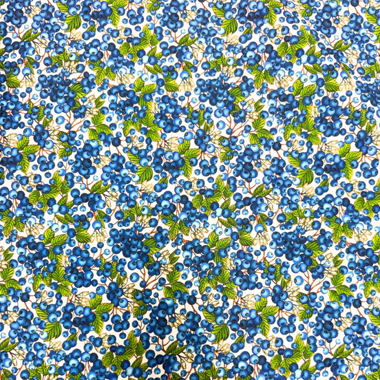 Pattern of blue berries and green leaves on a white background