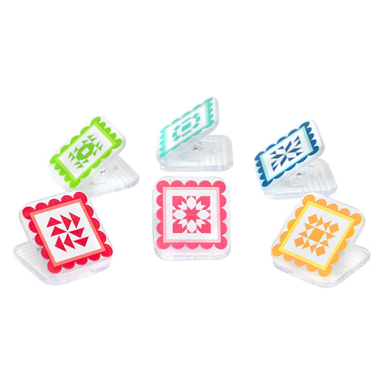 Set of six decorative stamps with colorful designs on a white background