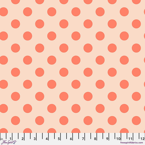 Pattern of orange polka dots on a beige background with a ruler at the bottom.