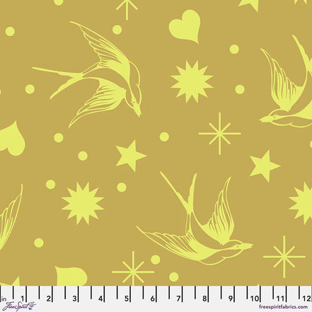 Fabric pattern with bright yellow birds and stars on a muted yellow background, featuring a ruler at the bottom.