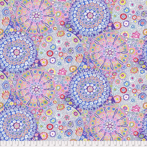 Colorful floral and geometric pattern fabric with a ruler at the bottom