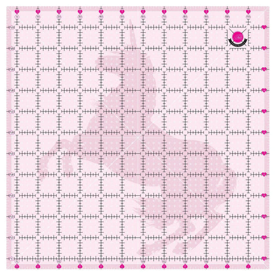 Pink grid ruler with measurement markings on a pink background