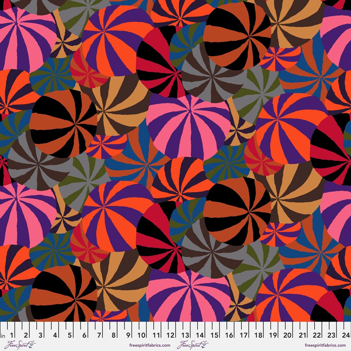 Colorful pattern of circular shapes with a ruler at the bottom for scale.