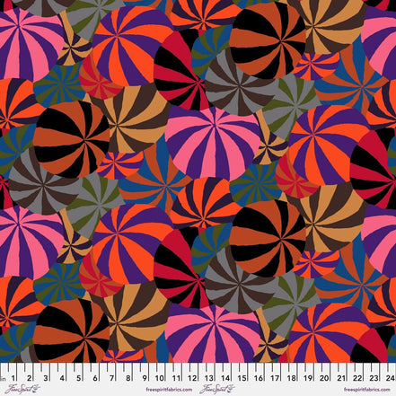 Colorful pattern of circular shapes with a ruler at the bottom for scale.