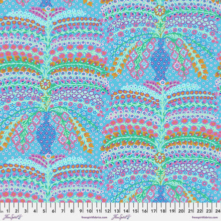 Colorful paisley pattern fabric with a ruler at the bottom