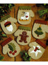 Set of felt Christmas ornaments shaped like mittens and snowmen on a wooden background.