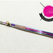 Multicolored craft knife with 'Tula Pink' branding on a white background