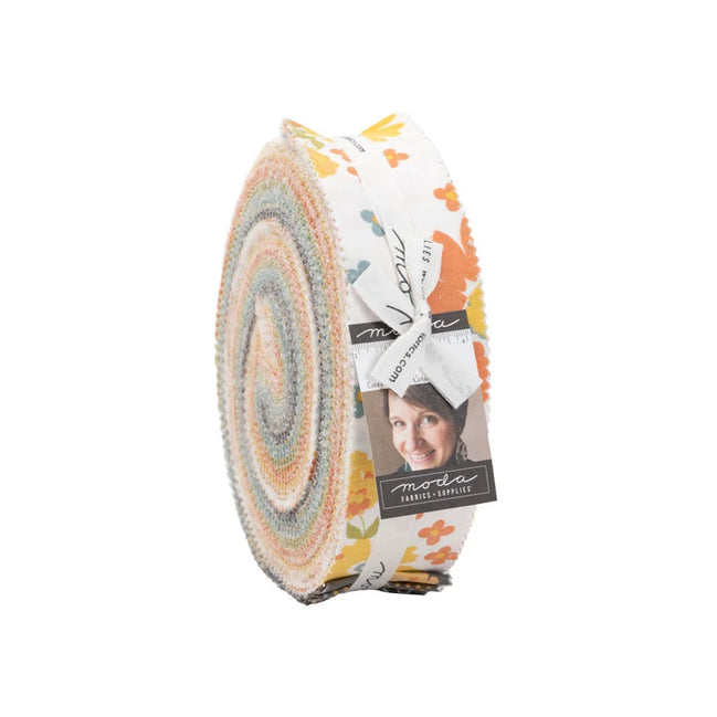 Fabric roll with circular pattern and visible brand label on a white background