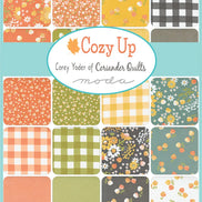 Collection of fabric squares with various patterns and colors, featuring the brand 'Cozy Up' by Corey Yoder of Coriander Quilts.