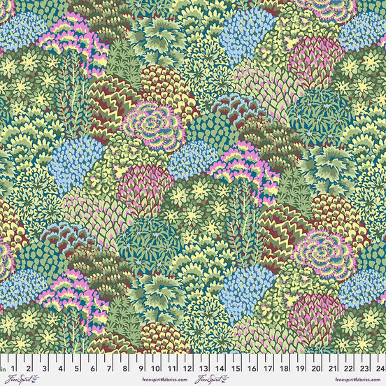 Colorful patterned fabric with a ruler at the bottom for scale.