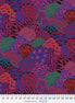 Colorful patterned fabric with a ruler at the bottom for scale