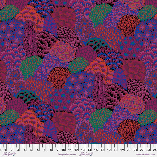 Colorful patterned fabric with a ruler at the bottom for scale