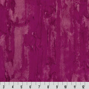 Textured purple fabric pattern with a ruler at the bottom