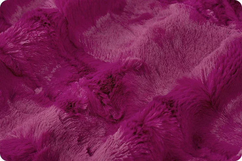 Close-up of a textured purple fabric surface