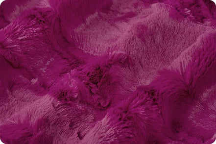 Close-up of a textured purple fabric surface
