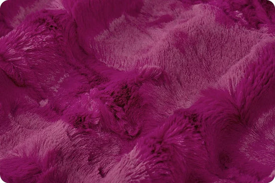 Close-up of a textured purple fabric surface