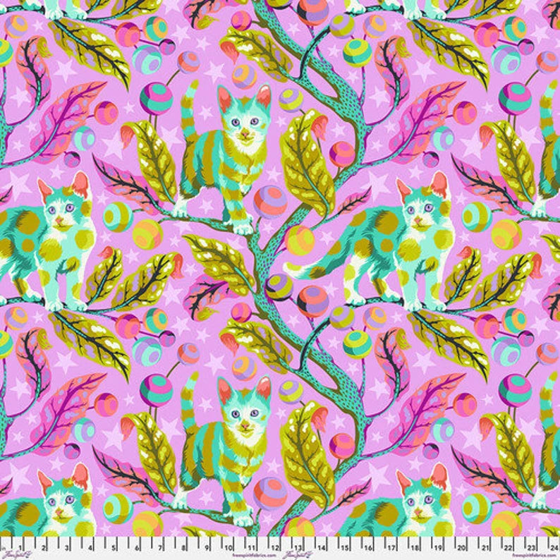Colorful fabric pattern with cats, leaves, and branches on a pink background
