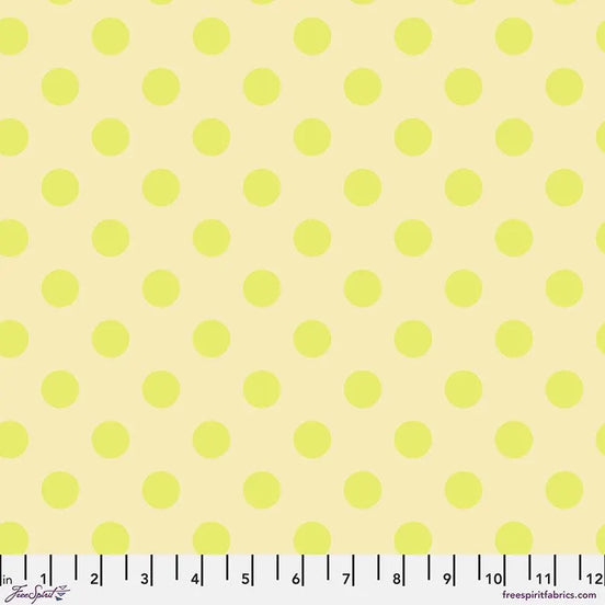 Fabric with small yellow polka dots on a light yellow background