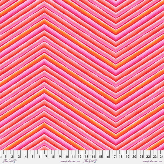 Fabric with pink and orange chevron pattern, Free Spirit Fabrics brand visible