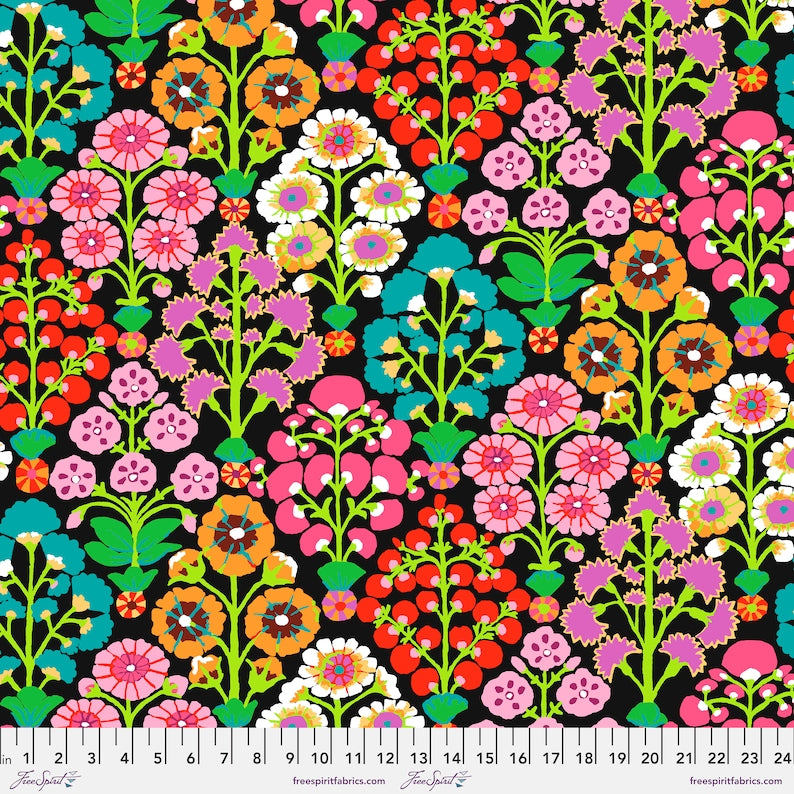 Colorful floral pattern on a black background with a ruler at the bottom.
