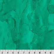 Textured green fabric with a ruler at the bottom