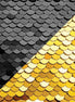 Close-up of black and gold sequin fabric