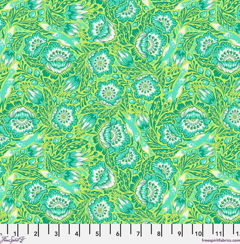 Patterned fabric with green floral design on a green background