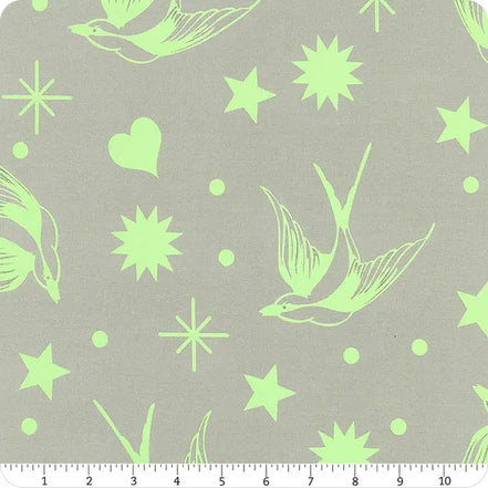 Fabric with green birds, stars, and hearts on a gray background