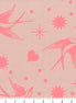 Fabric with pink birds and starburst patterns on a beige background, ruler at the bottom.