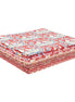 Stack of red and white patterned fabric pieces on a white background