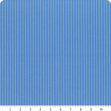 Blue fabric with tiny lime stripes with a ruler at the bottom for scale.
