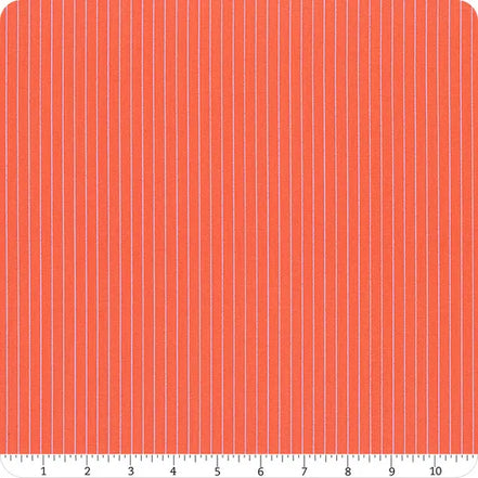 Fabric with vertical light blue stripes on a red background, measured against a ruler.